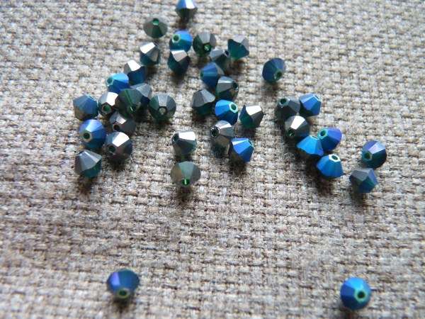 sw bicone 4 mm: emerald AB/crom Xilion